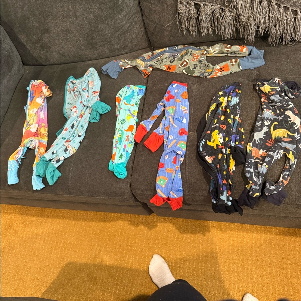 Fancy onesies bundle of 8.  NB and 0-3 month fit.
